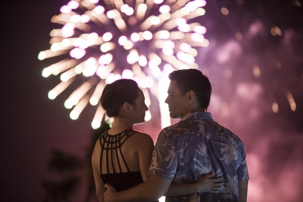 A couple watches the fireworks at Prince Waikiki.