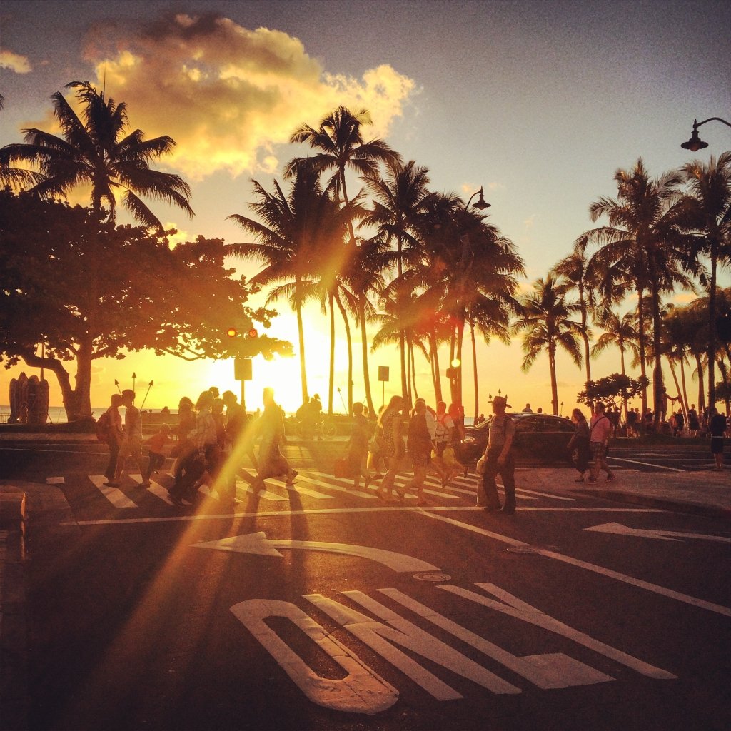 Waikiki beach sunset. people crossing street